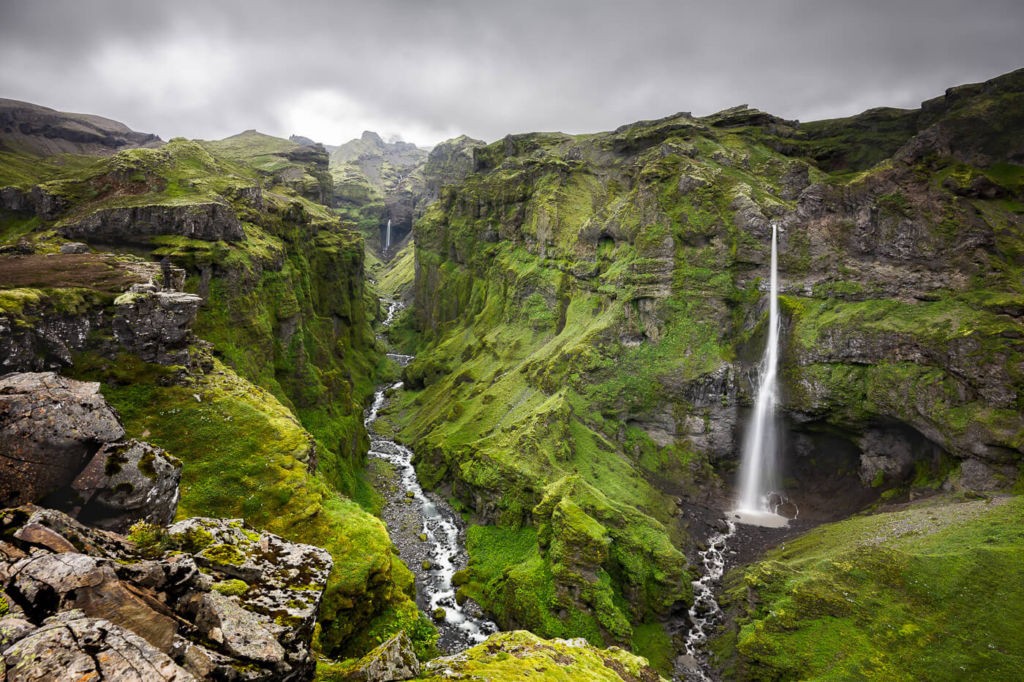 Múlagljúfur canyon is one of the best hikes and photography locations in iceland, with waterfalls and green lush vegetation.