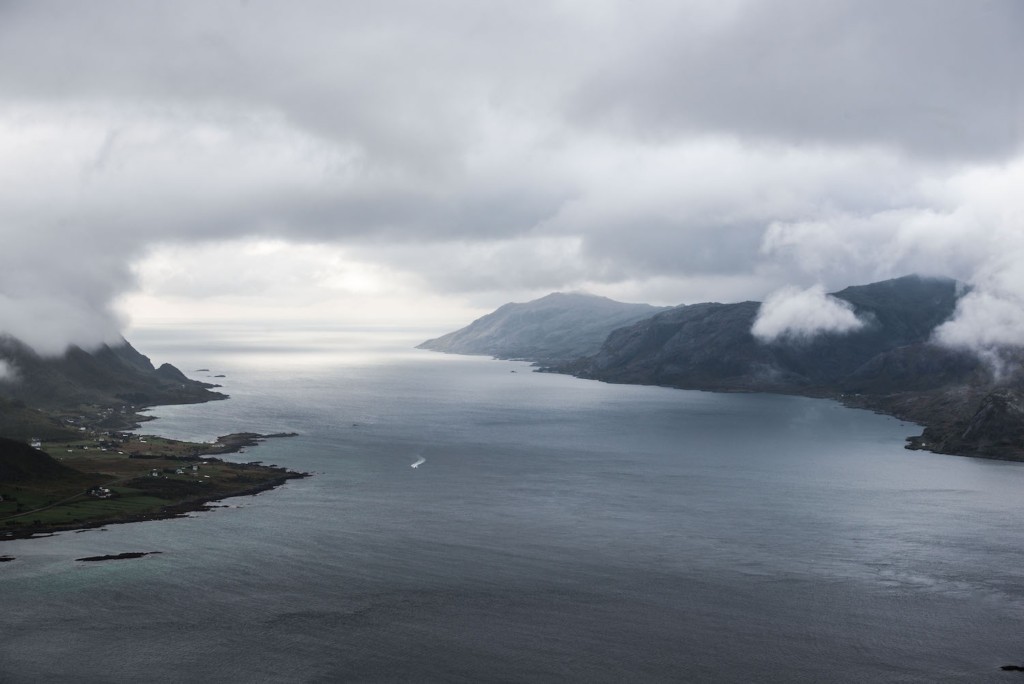 View of a nowegian fjord on a grey and cloudy day.