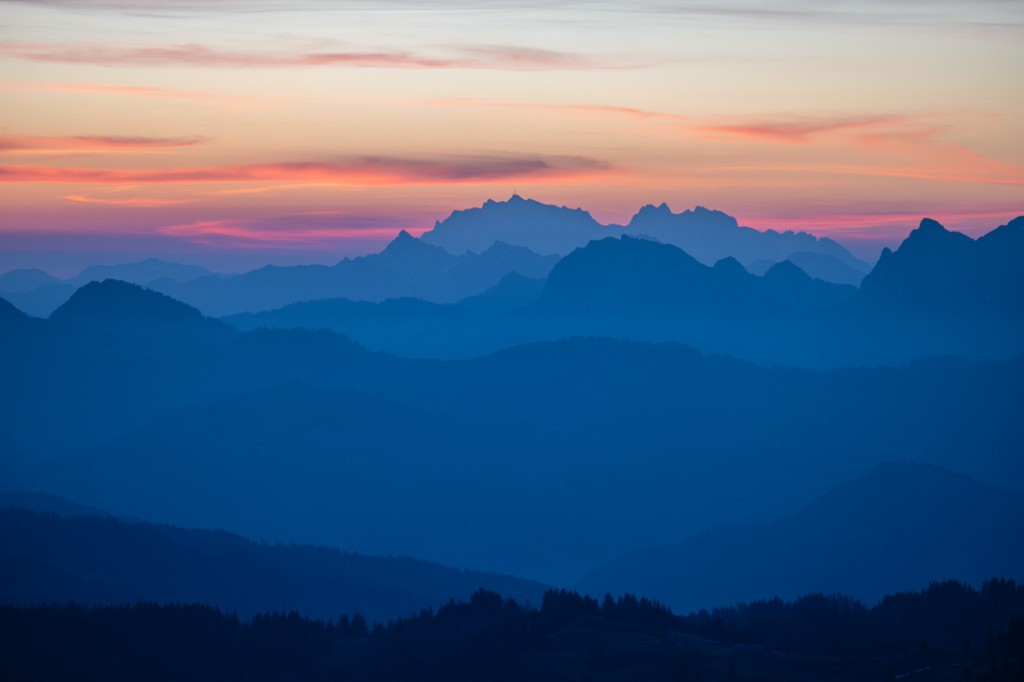 Colourful skies and misty mountains at sunrise