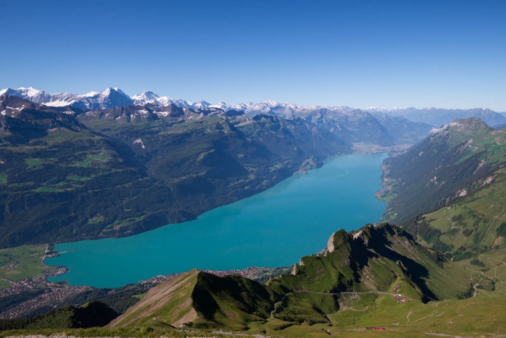 View from the top of the Brienzer Rothorn over the lake on a bright sunny day