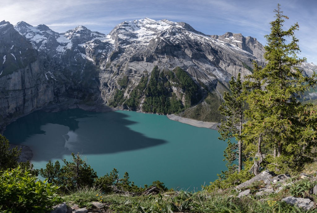View of the alpine lake Oeschinensee and the surrounding mountains from the upper part of the trail