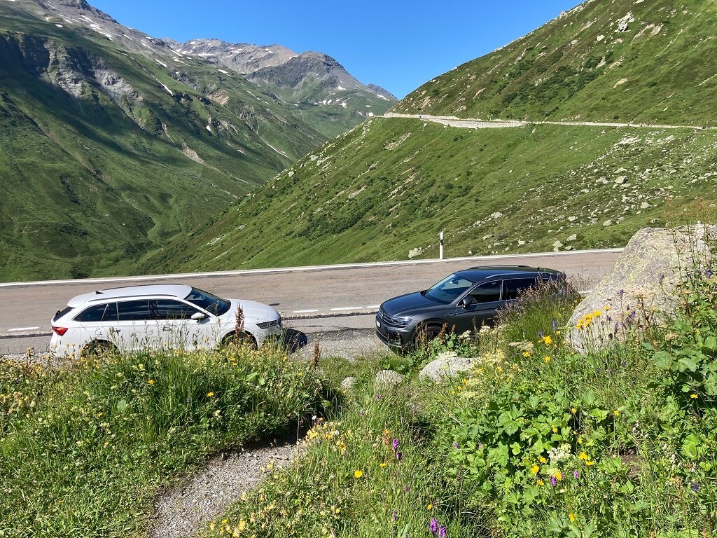 Cars parked on the side of the road on the Furkastrasse