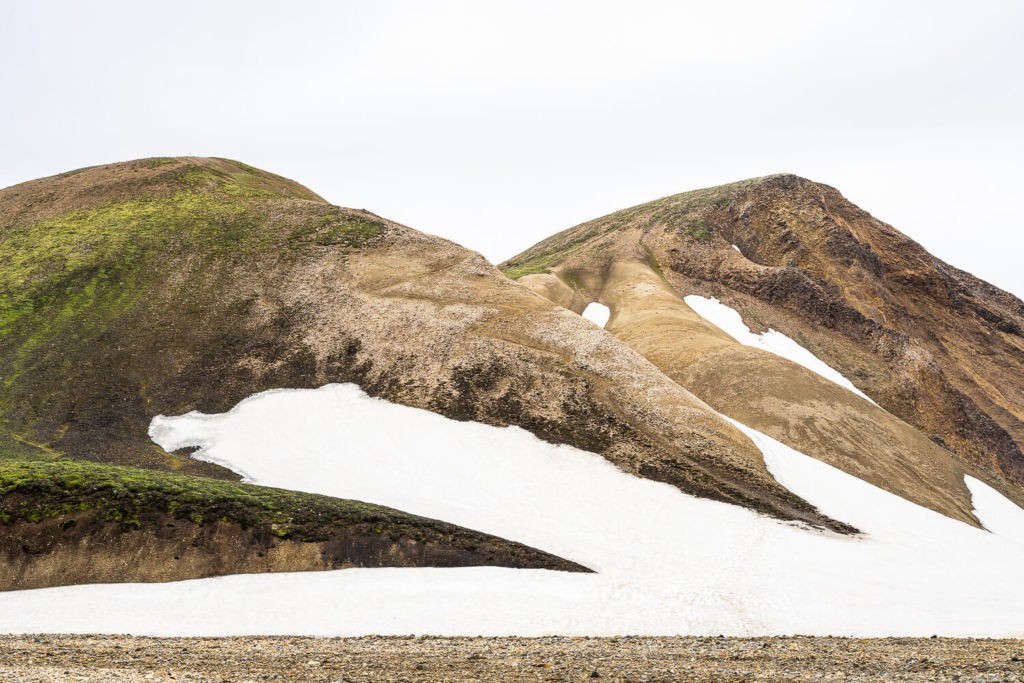 Hill partially covered in snow in Landmannalaugar