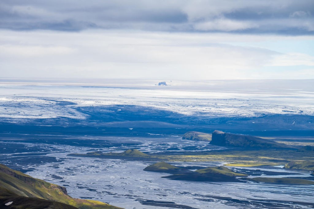 The Vatnajokull ice cap and the skate river viewed from the top of Sveinstindur