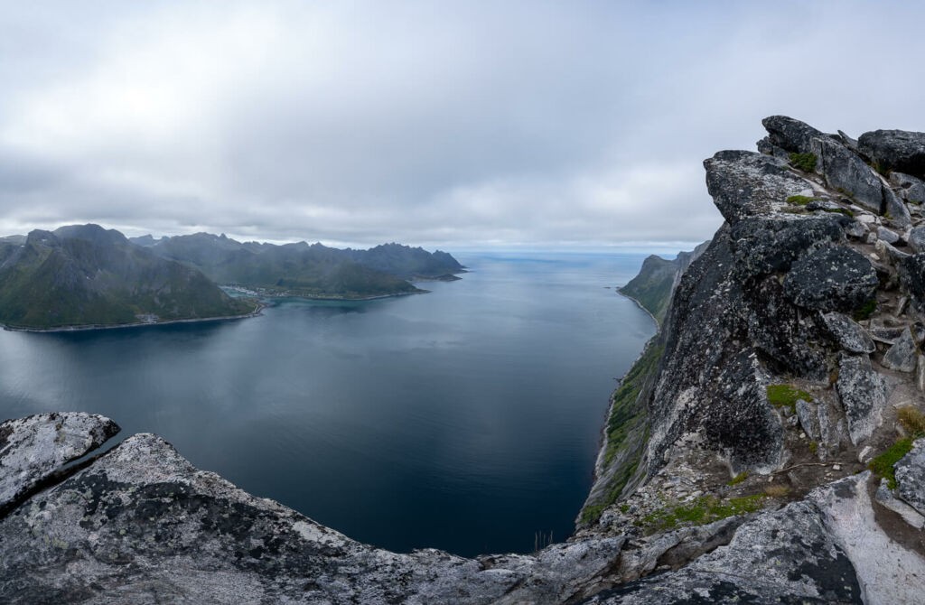 Panoramic view from the cliffs of the mountain Segla over a fjord