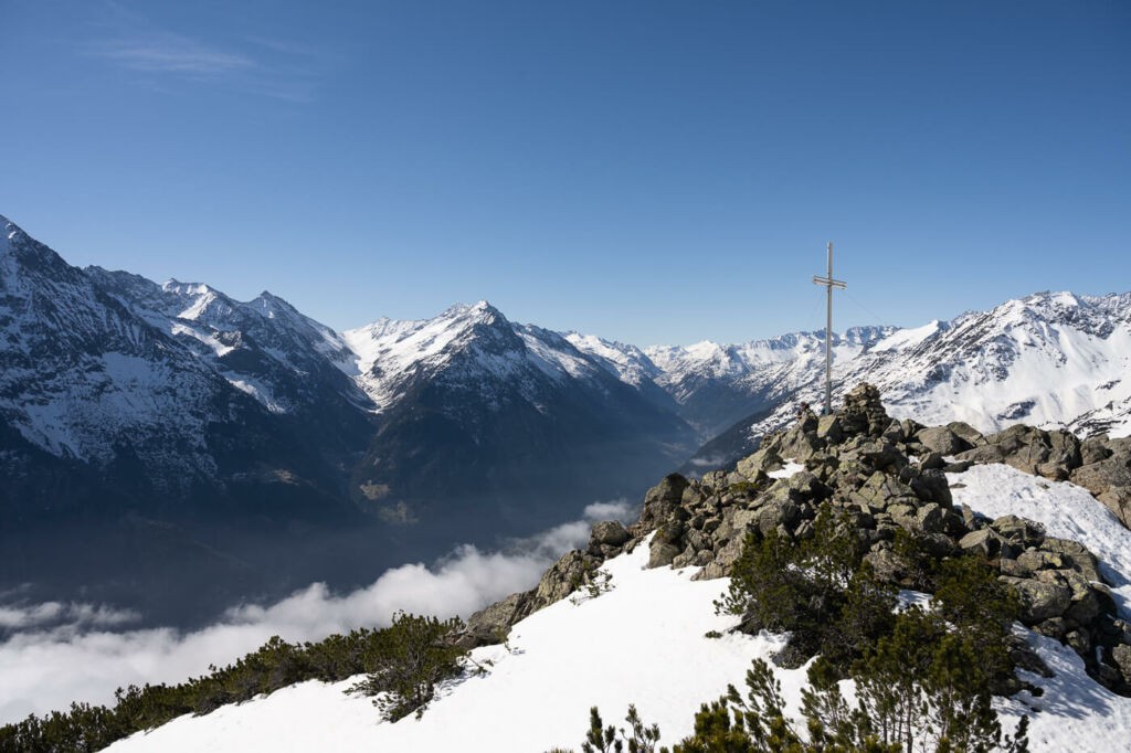 Sunnig Grat mountain summit and the surrounding alpine landscape
