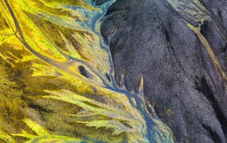 Flying Drones in Iceland image of a colourful river taken from a drone.