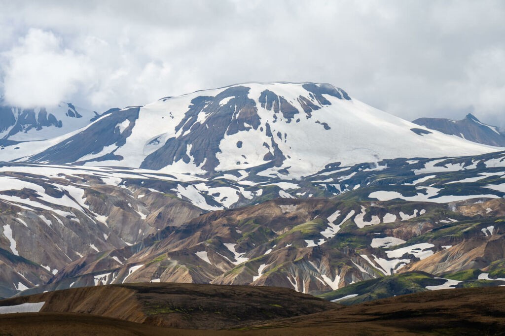 Snow-capped mountain in summer in the highlands of Iceland, along the Skalli trail