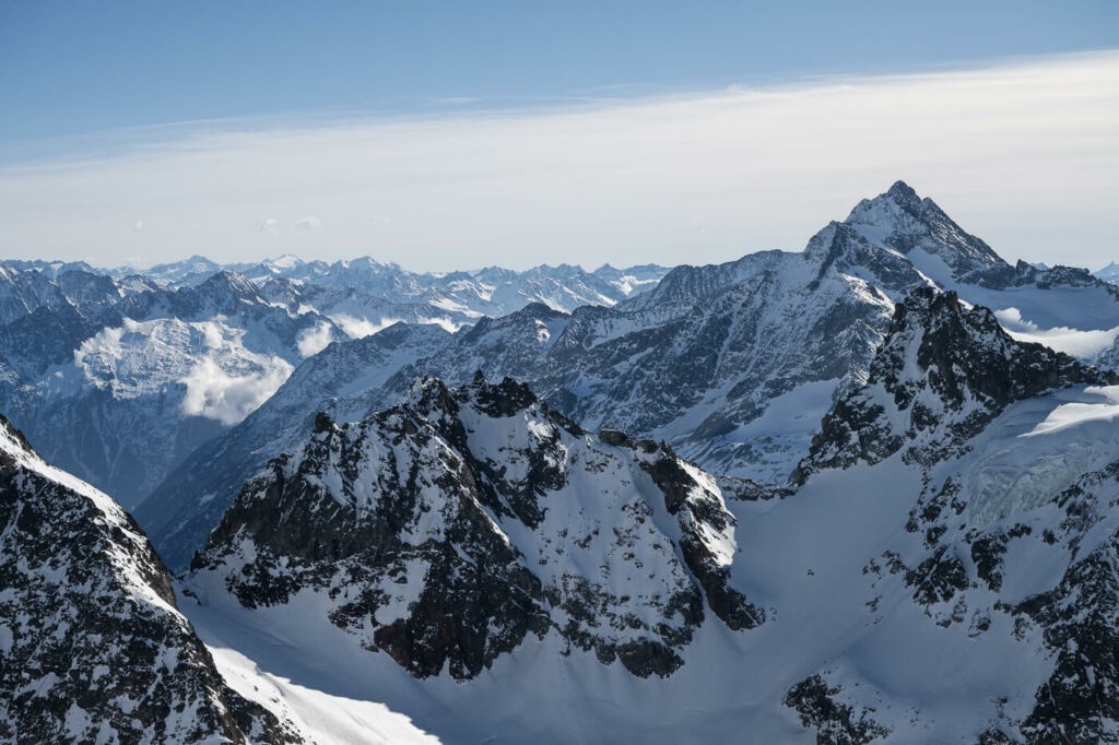 View of the swiss alps from the top of titles on a sunny day