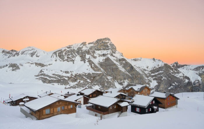 Melchsee Frust and huts covered in snow at Sunrise