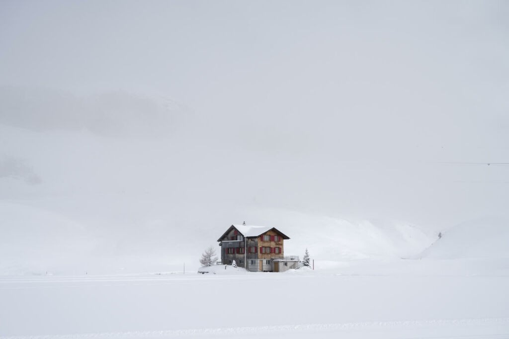 A lonely and isolated hut surrounded by a snowy landscape in Melchsee.