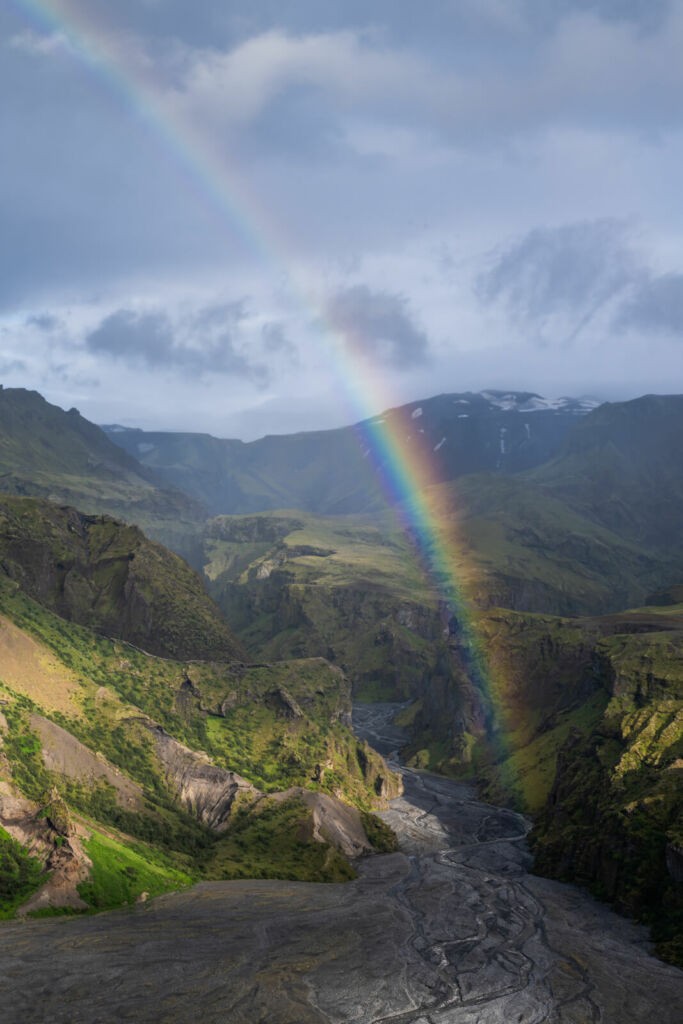 Landscape phohography of a rainbow at the entrance of a canyon in Iceland photographed with the Nikkor Z 70-200 f2.8