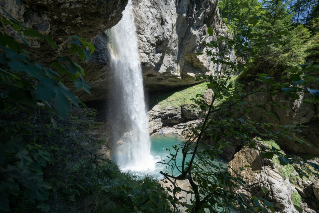 Waterfall with a cave behind in Switzerland