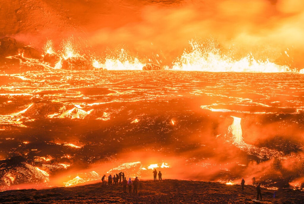 Hikers enjoying the 2022 Fagradalsfjall volcanic eruption in Meradalir, Iceland.