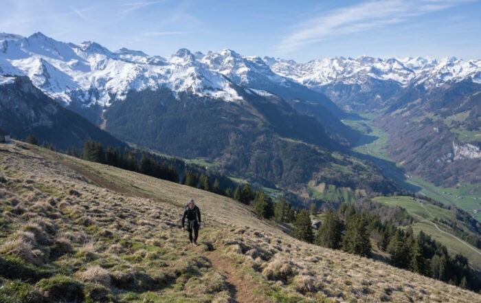Hiker on a hike to the top of the Buochserhorn, one of the best hikes around Lake Lucerne.