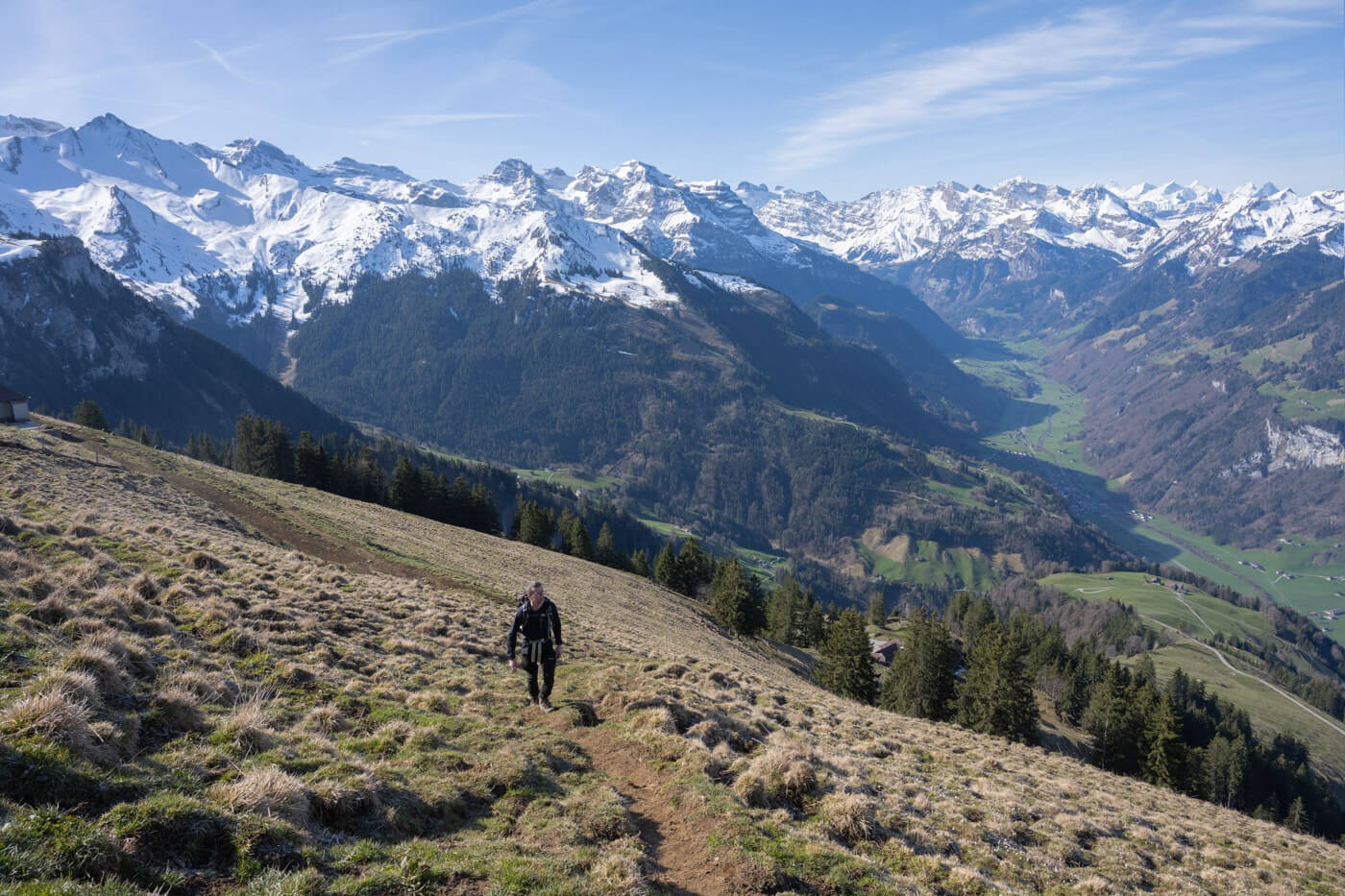 Hiker on a hike to the top of the Buochserhorn, one of the best hikes around Lake Lucerne.