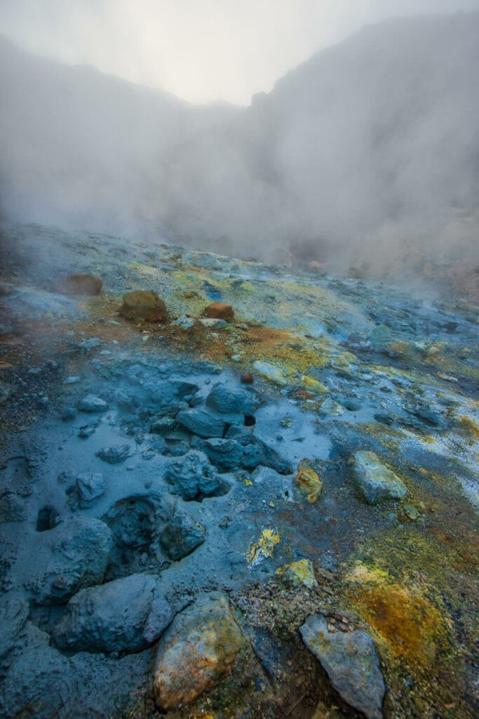 colored mud in in the Seltún Geothermal area in Iceland