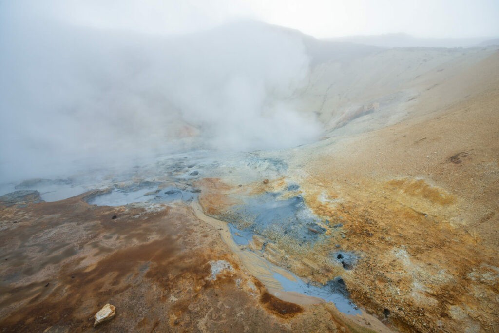 Steamy and colorful fumaroles in the fog