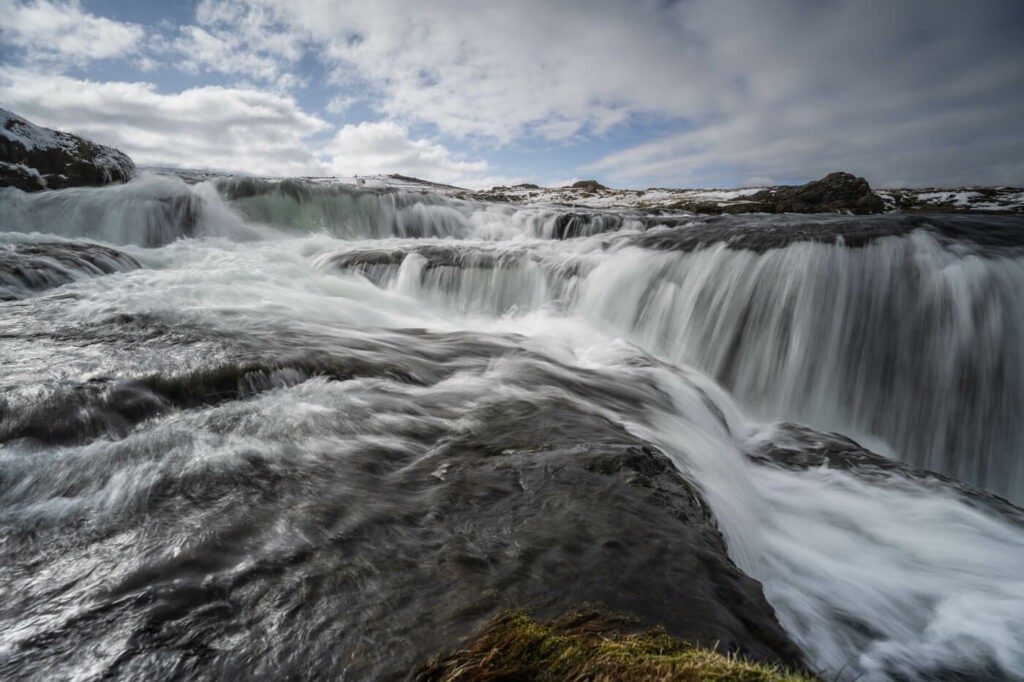 Reykjafoss waterfall in a long exposure photo.