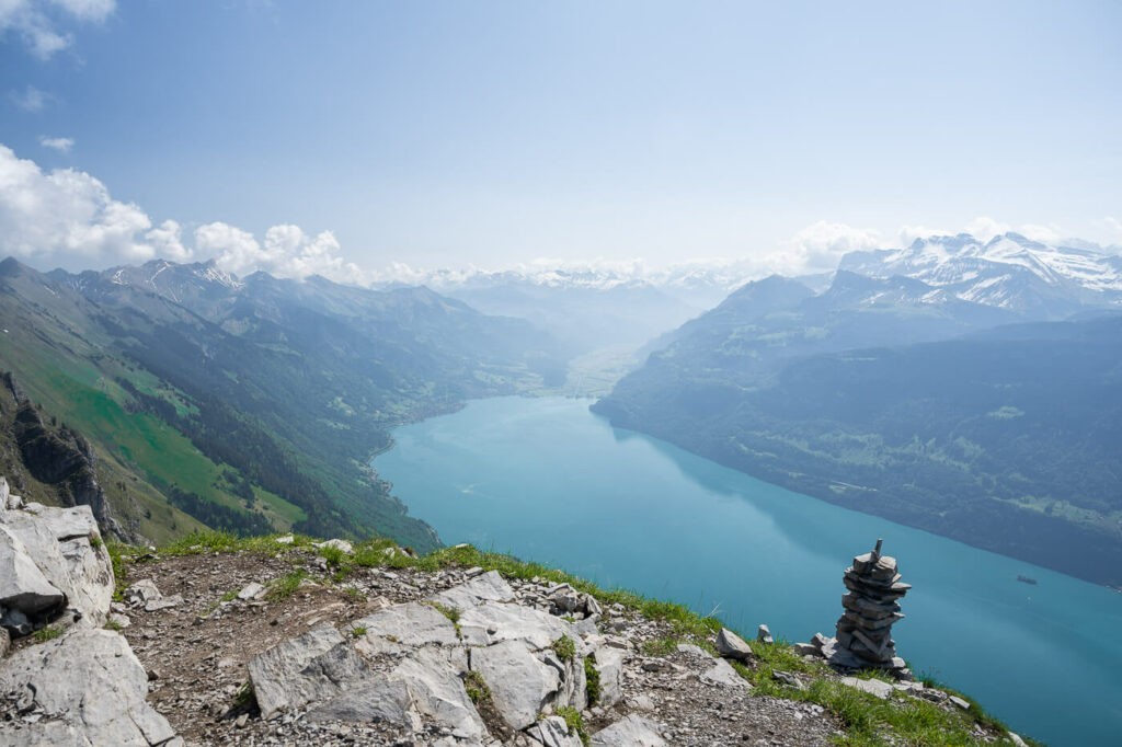 Panoramic view of the blue waters of Lake brine from the summit of the Suggiture, where a small cairn stands.