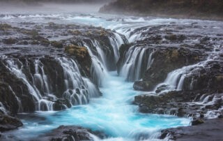 The Brúarfoss Waterfall and it sblue water whic can be admire during a hike