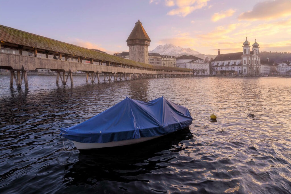 The famous Chapel Bridge in Lucerne with Mount Pilatus in the background