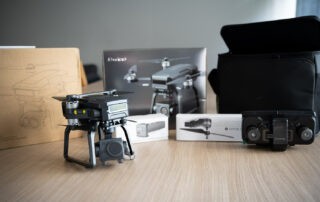 Bwine F7GB2 drone on a table for review showing the boxes and their content.