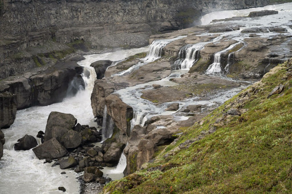 View from above of multiple waterfalls in a canyon in Iceland along the Þjórsá river