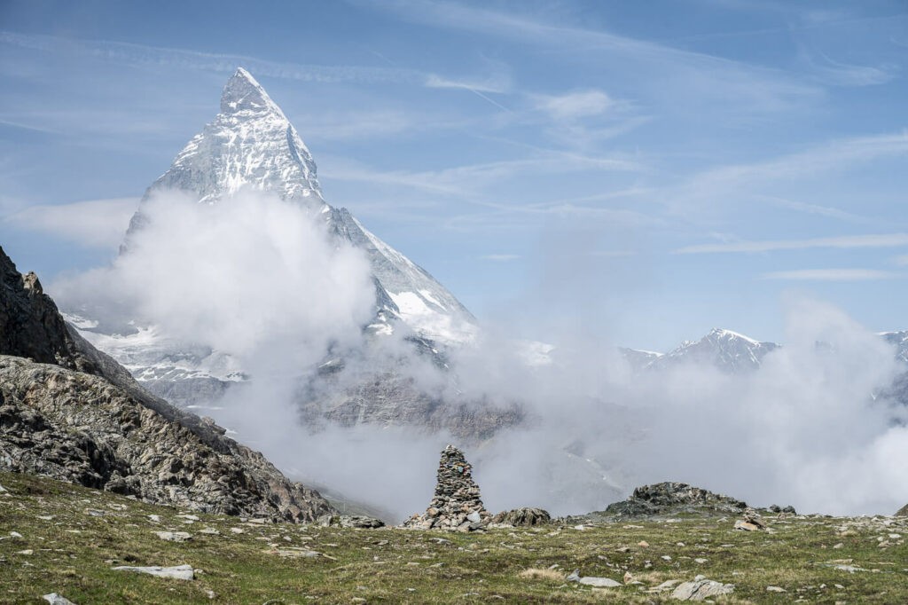 the Matterhorn and a cairn on the hiking trail from Zermatt to the riffelsee and the Gornergrat