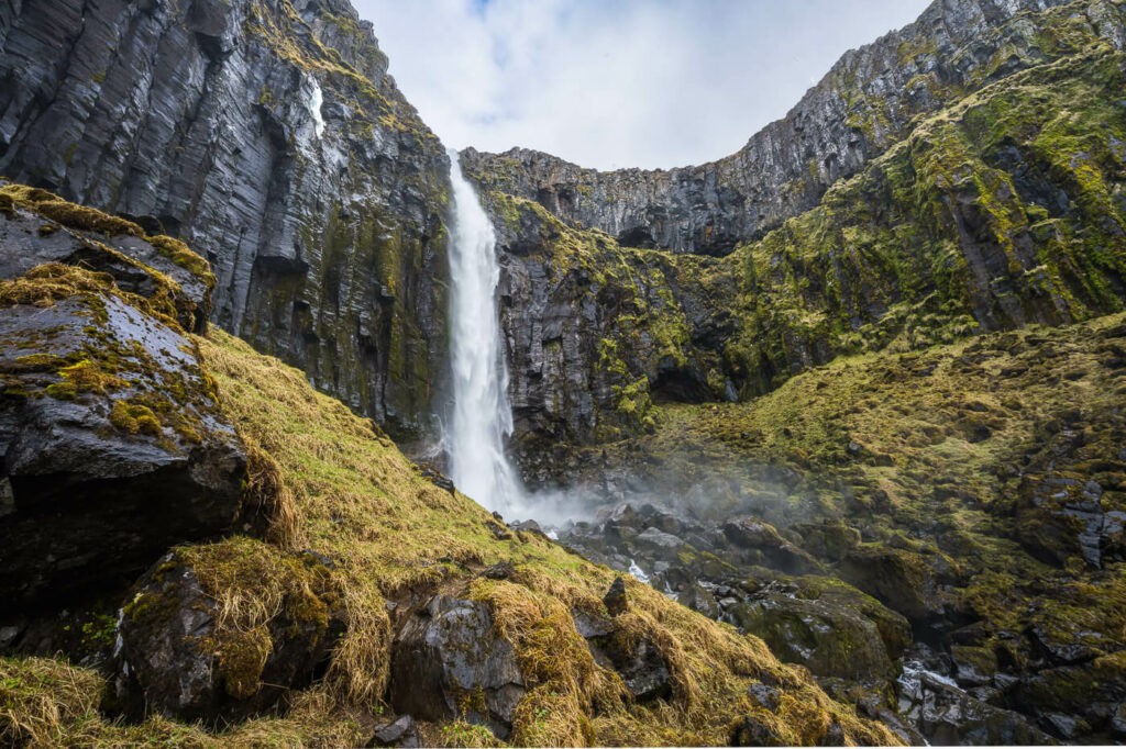 Grundarfoss Waterfall surrounded by basalt columns