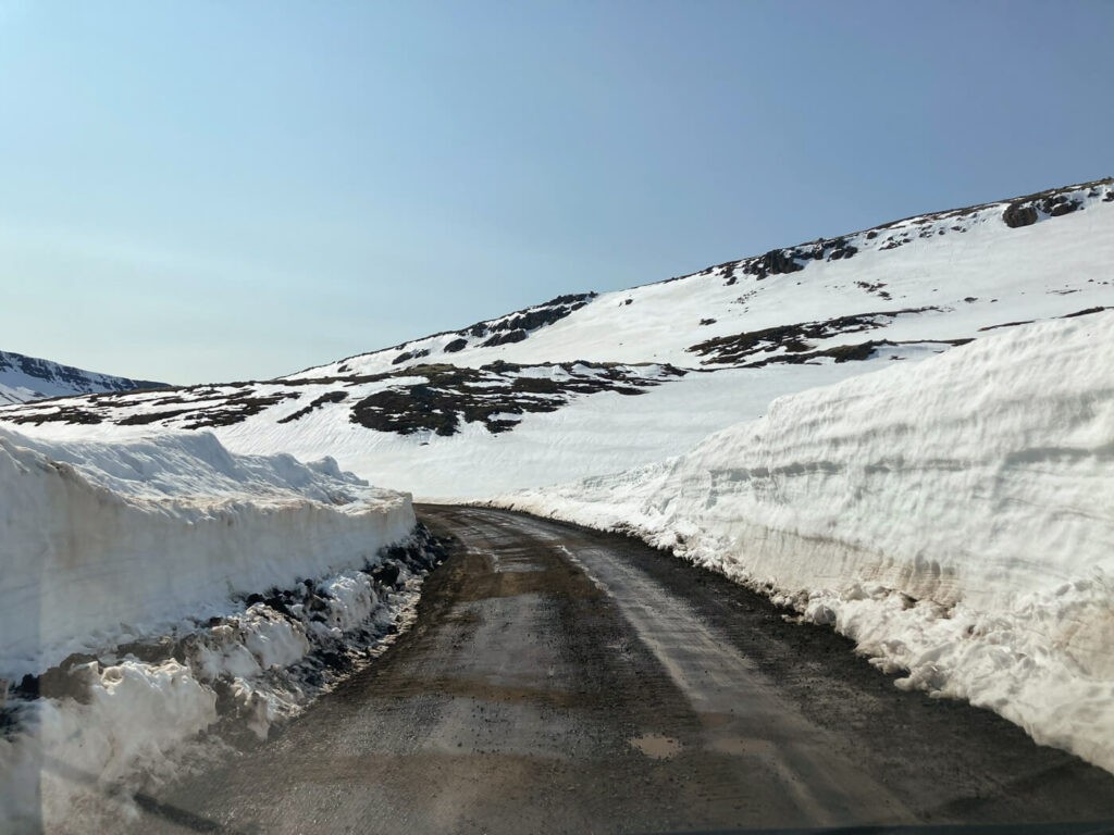 Road 953 to Mjóifjörður with a lot of snow around it in late May