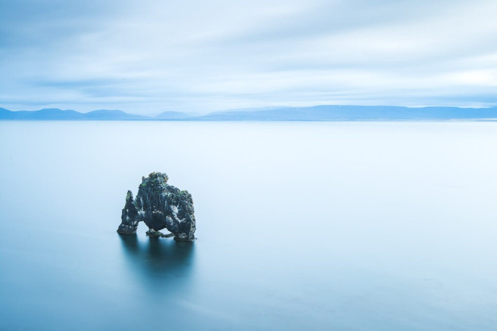 Hvítserkur or the troll of the northwest in a long exposure photo with blue tones
