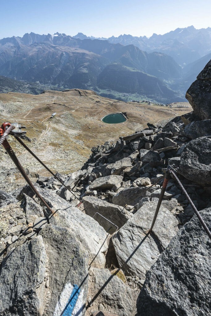 trailmarks and view of the mountains around the unesco high altiture ridge trail in the aletsch arena