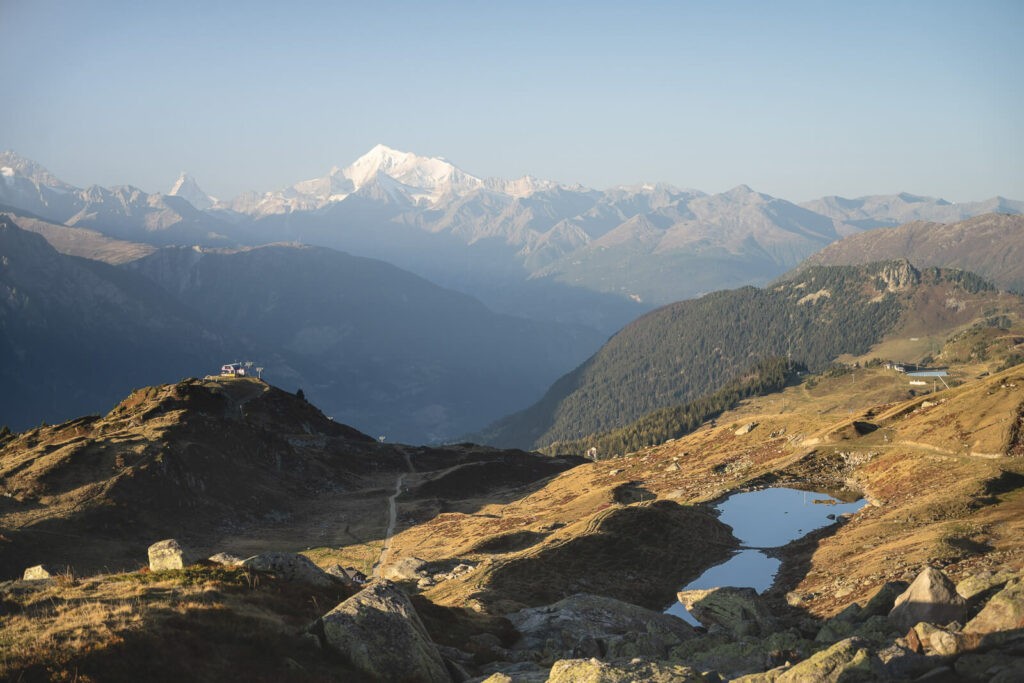 view of swiss alps from a mountain on a clear sunny day