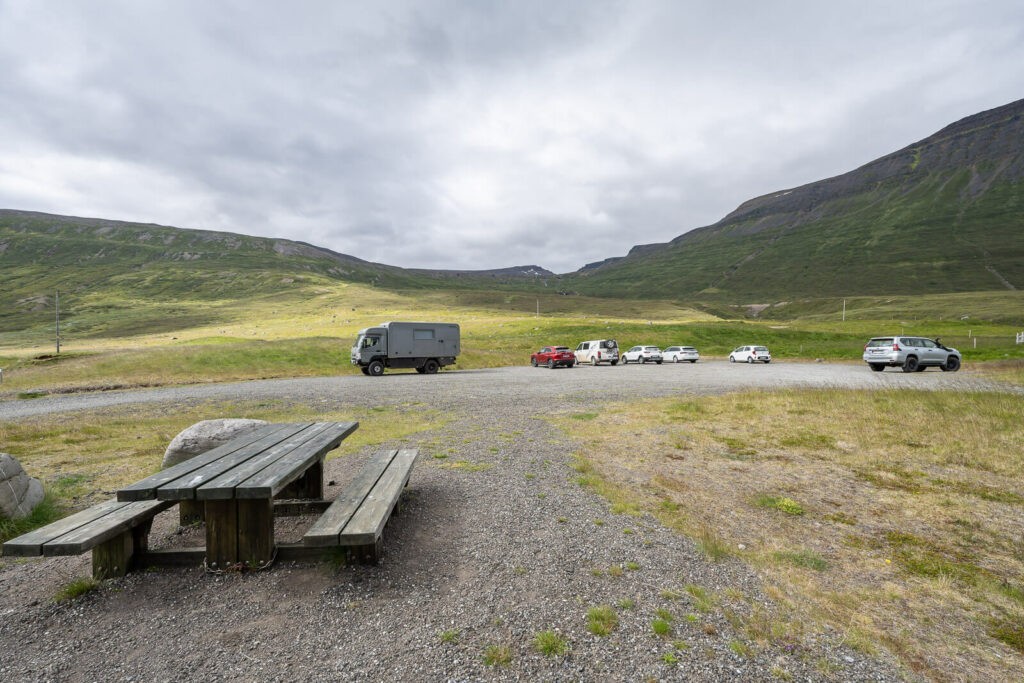 Valagil Parking area with some cars and a picnic table.