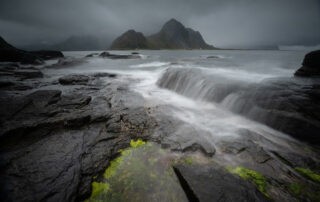 Moody landscape photo of a seascape on a cloudy and overcast day.