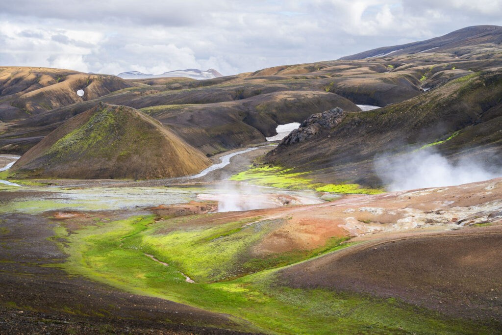 geothermal area on the haalda hiking trail with green mosss and the typical colorful landmannalaugar mountains