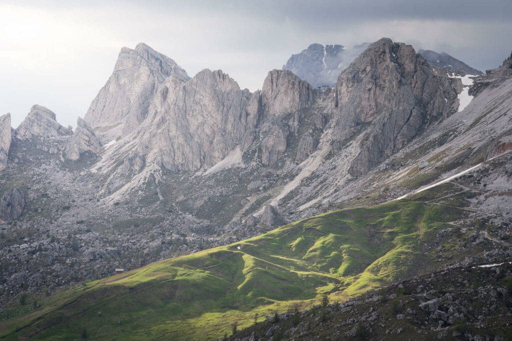 Light on the mountains around Passo Giau, on the rocky and green fields landscape of the dolomites.