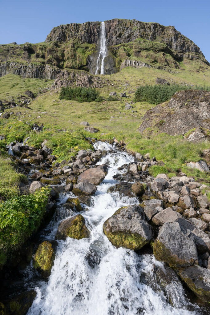 one of the tallest waterfalls in the Snaefelsness peninsula on a sunny day