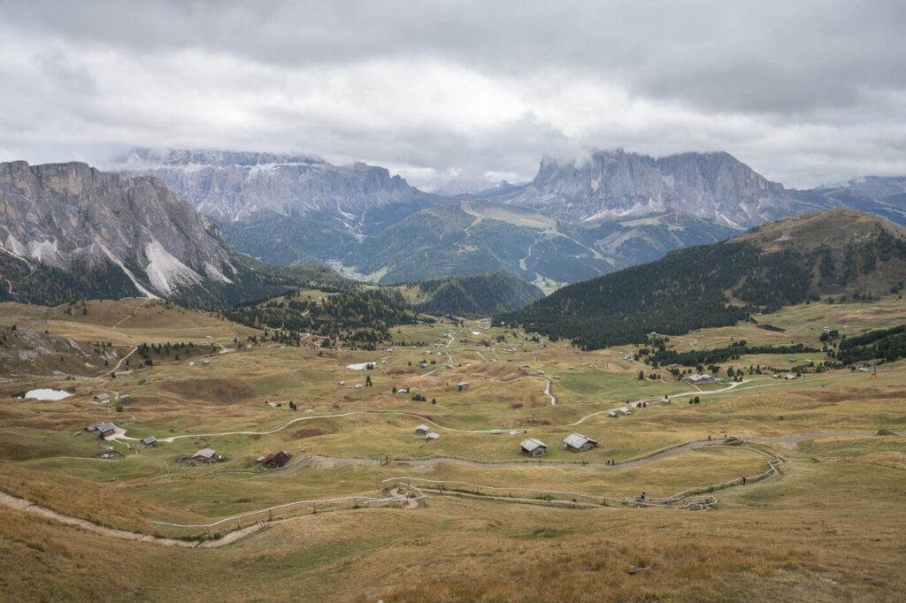 View of mountain huts in the dolomites on the hiking trail to the Seceda Ridgeline