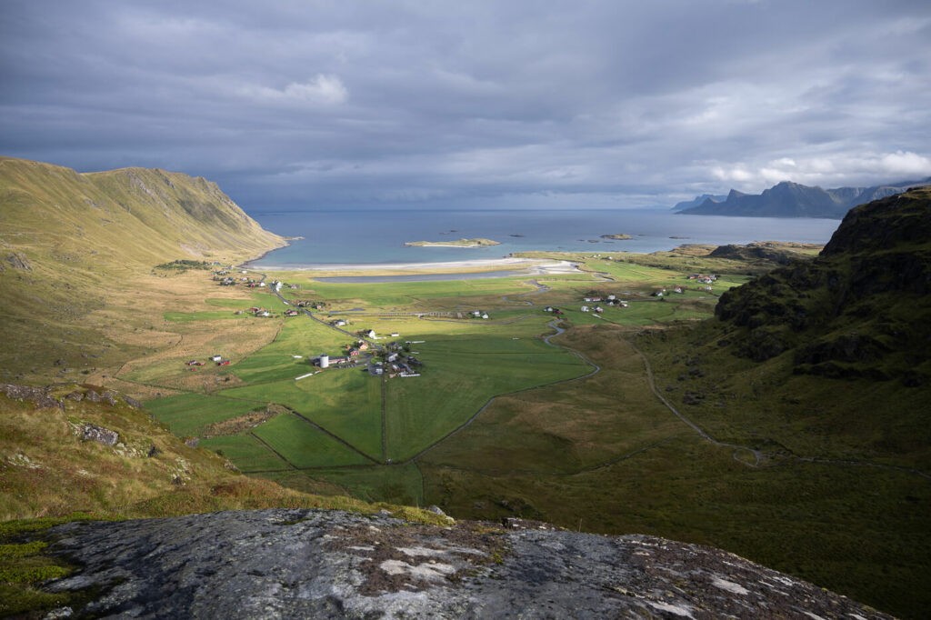 Panoramic viewpoint from a trail in the lofoten view view of farms and the sea and the mountains