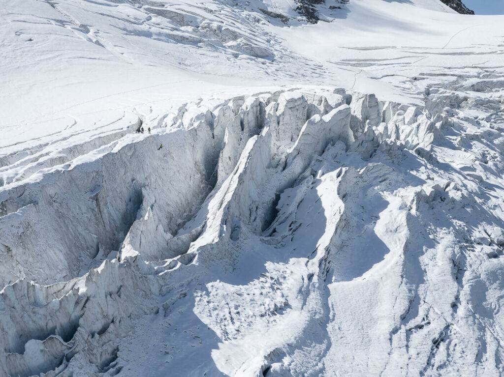 Crevasses of the steingletscher that can be admire at the end of the hiking trail. A person rappelling down the ice can be seen too.