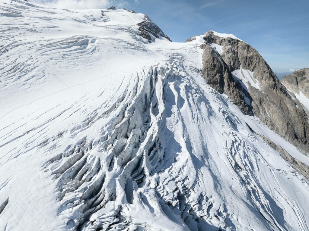 dreon aerial photos of crevasses of a glacier in switzerland