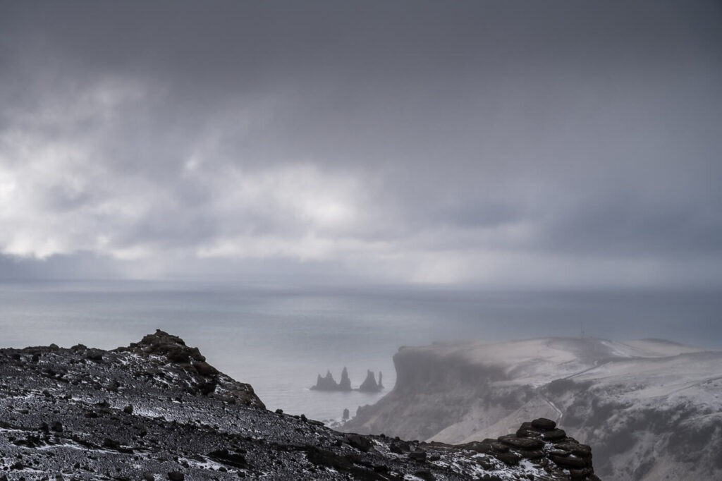 Reynisdrangar sea stacks under menacing and dark clouds