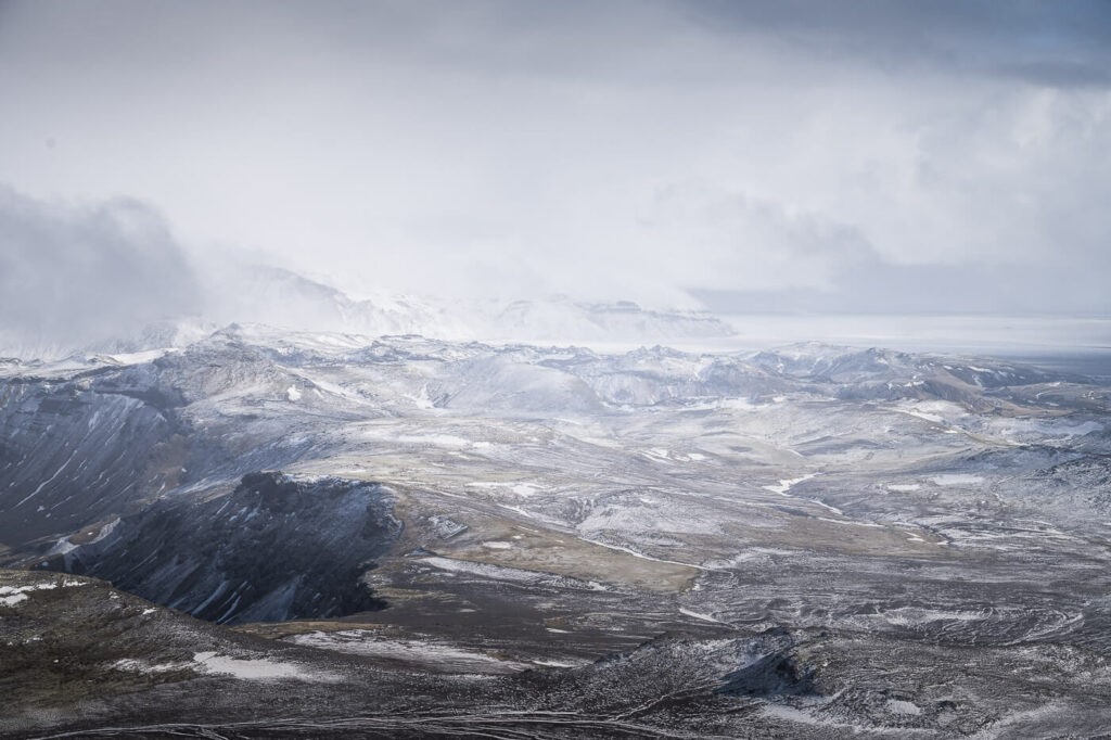 abstract panoramic image of land covered in snow and soft light diffused by clouds
